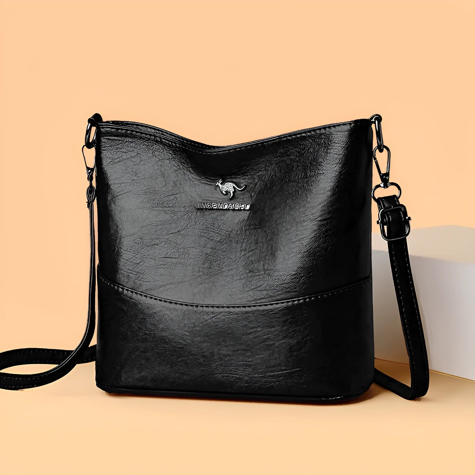 Women's bucket-shaped leather shoulder bag in minimalist style with large capacity