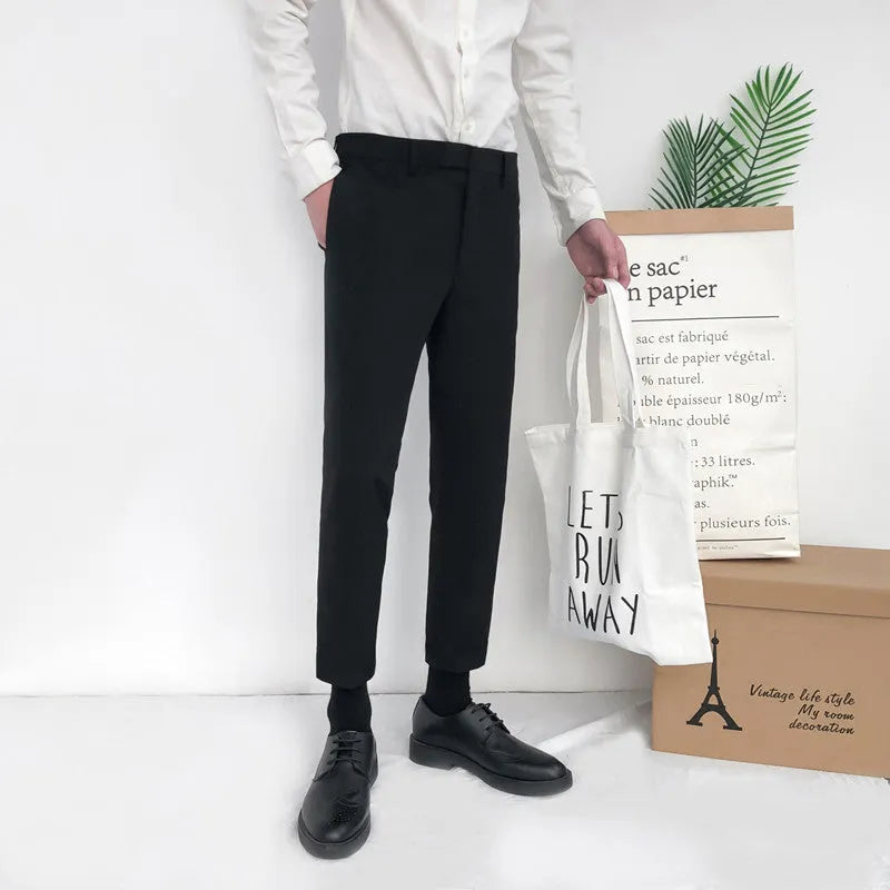 Men's straight-leg cotton trousers with drawstring waist in black, grey or khaki colours.