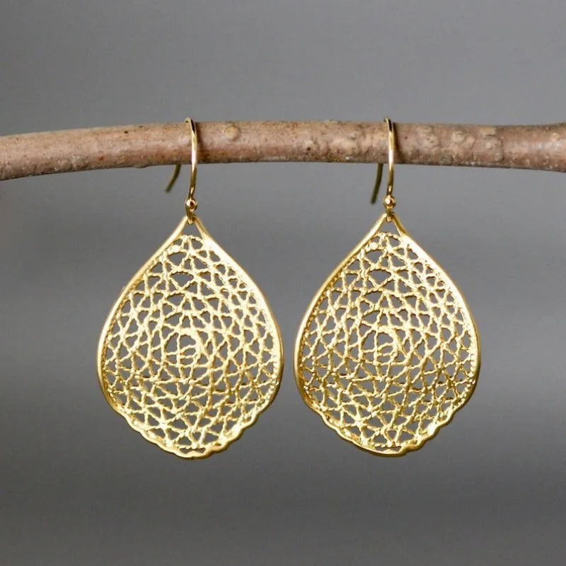 Gold retro leaf hollow pendant earrings with geometric drop design measuring 3.5cm in length