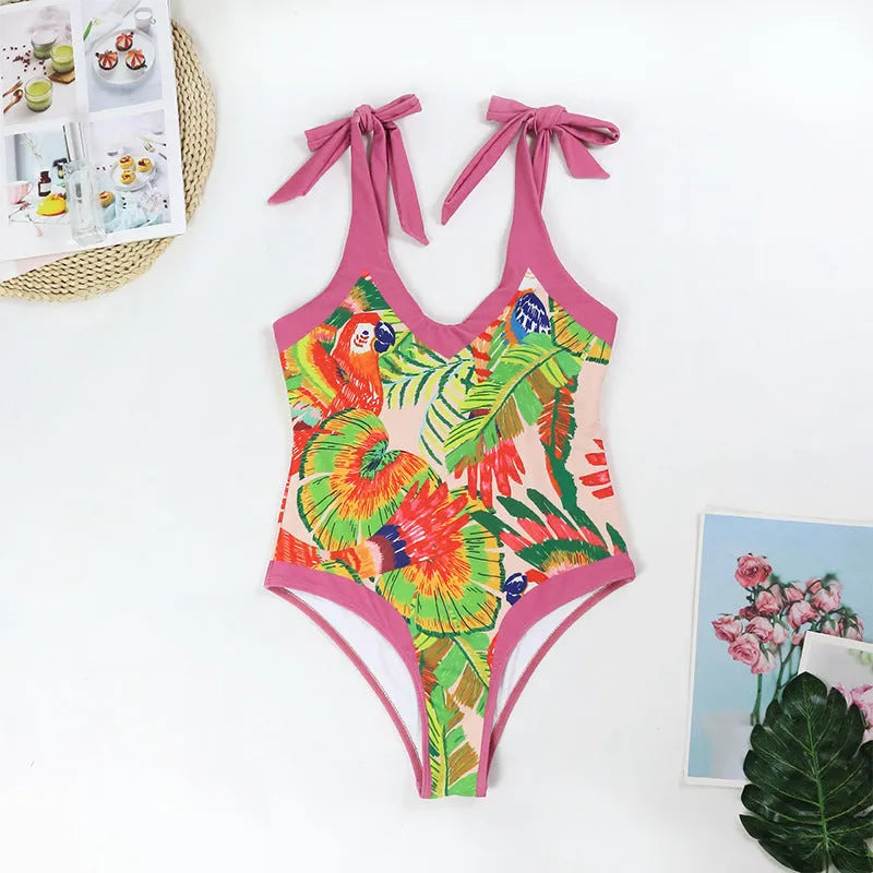 Pink floral print one-piece swimsuit with V-neck and attached skirt for women