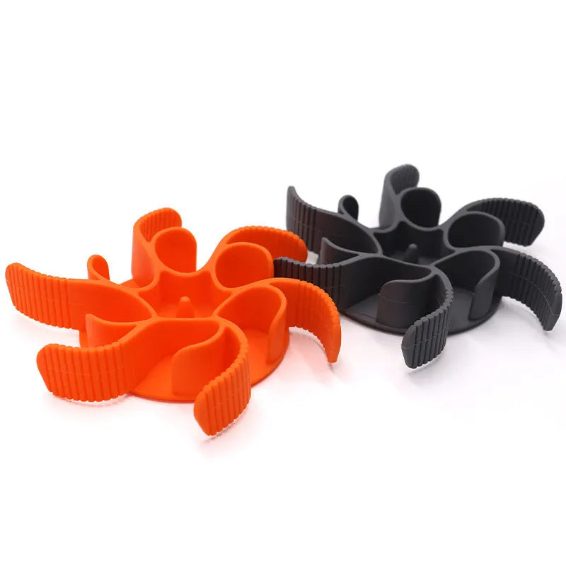 Red silicone dog slow feeder insert with spiral design and suction cups on a white background.