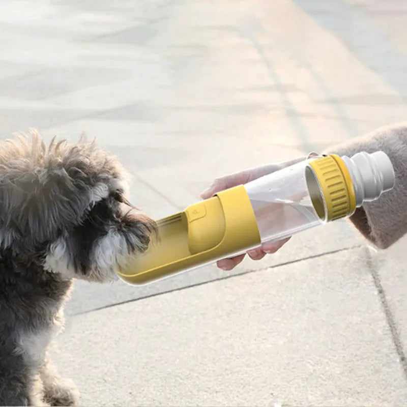 Dark blue dog water bottle with integrated drinking bowl, showing compact 215x75x75mm dimensions