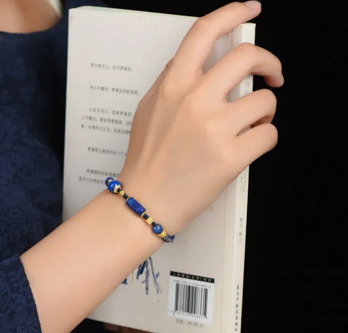 Hand-woven DIY watch band bracelet made from flexible wire in an ethnic lapis lazuli style.