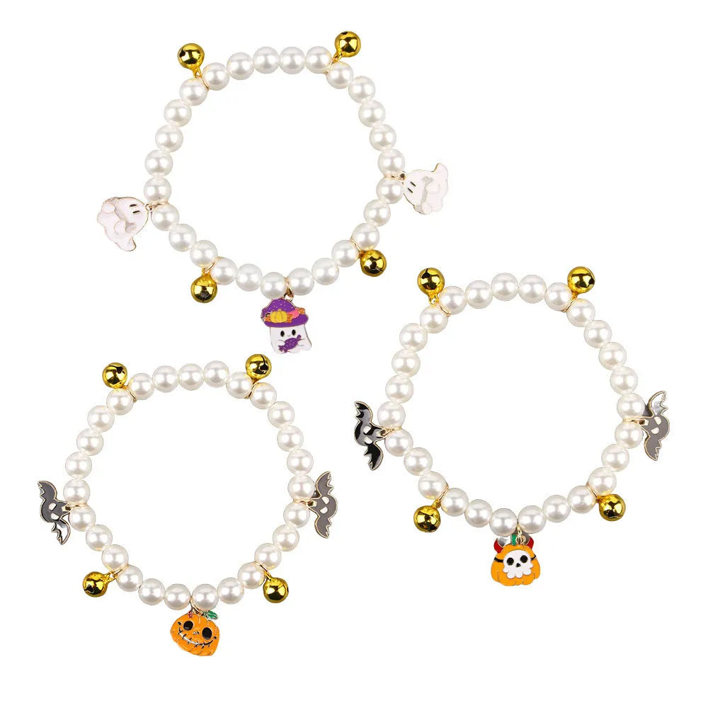 Halloween cat collar with simulated pearls and pumpkin designs in purple ghost, skull, and smiling motifs