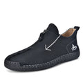 Men's black leather boots with front zipper, hand-stitched sole, and mid-calf length