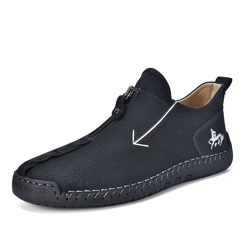 Men's black leather boots with front zipper, hand-stitched sole, and mid-calf length