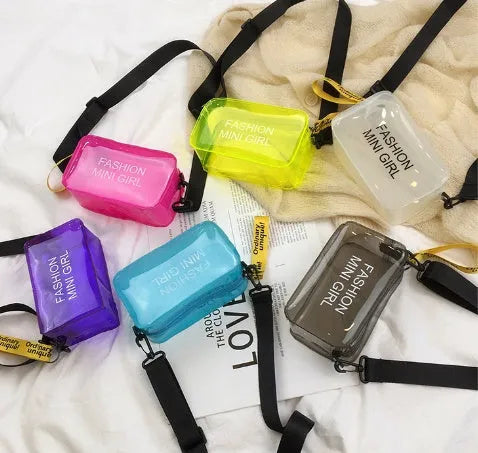 Transparent square jelly shoulder bag with adjustable strap in multiple colour options showing 19cm width dimensions