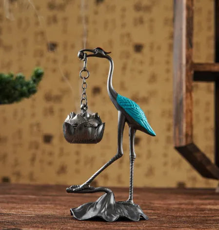 Chinese style gourd-shaped incense coil burner in copper alloy with dragon and phoenix design, painted blue or red top.