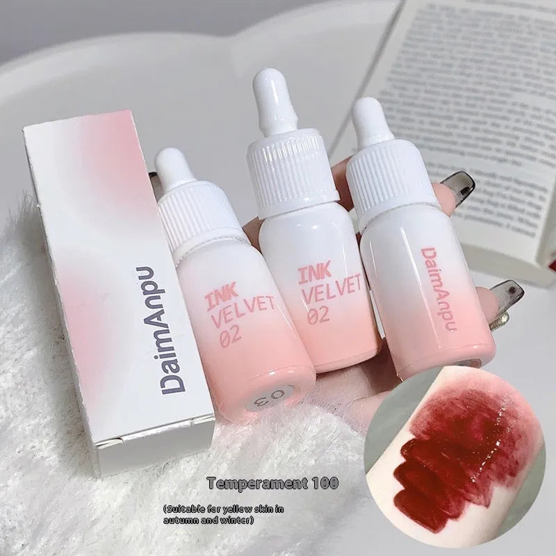 Mirror Lip Lacquer moisturising lip gloss tube in sheer shades on a plain background.