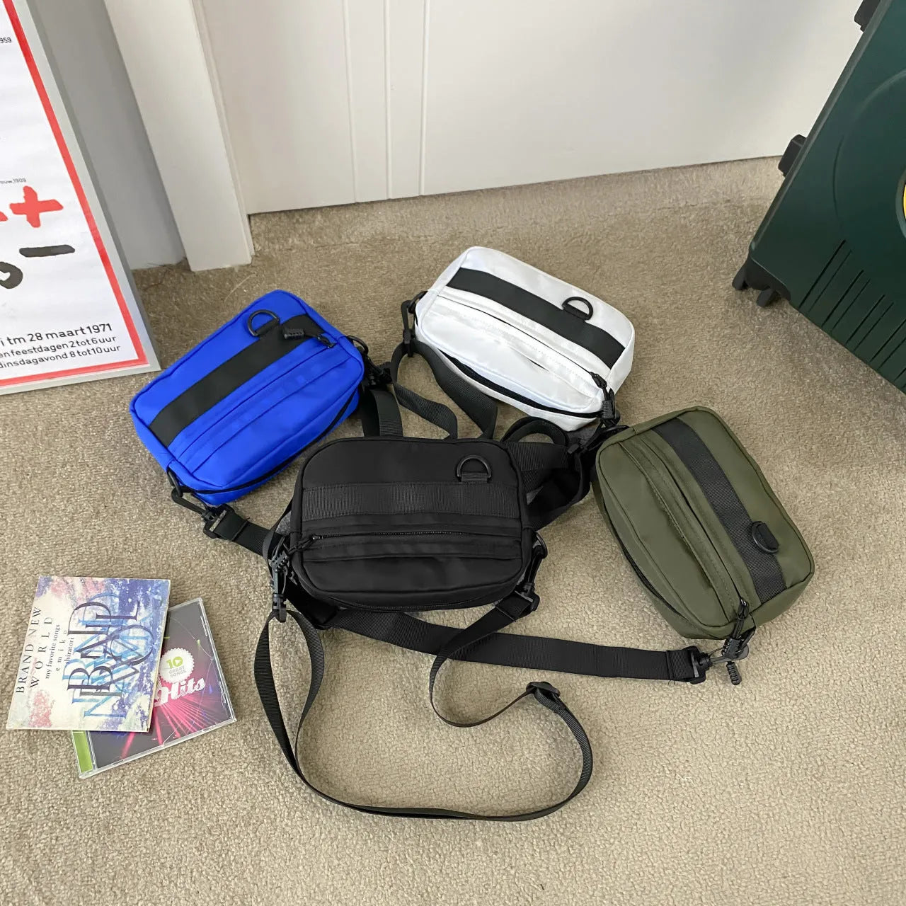Men's solid colour nylon crossbody messenger bag with visible sewing thread detail.