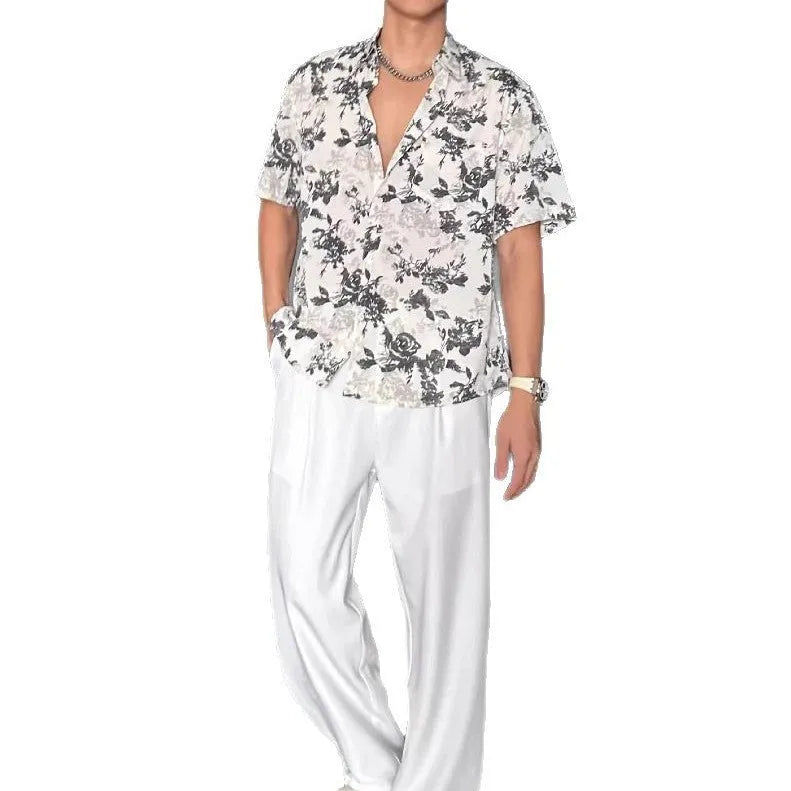 Loose casual printed shirt with short sleeves and floral pattern in black or white, sizes M to XXXL.