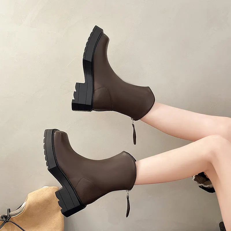 Black platform Martin boots for women with square toe, 6-8cm heel, and back zipper on a mid-calf shaft.