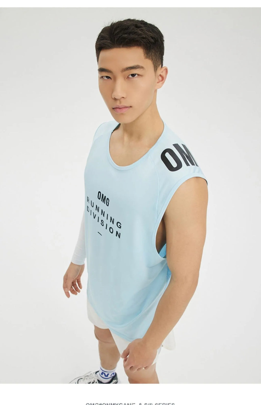 Men's loose fit black mesh sports vest on a hanger, showing breathable fabric texture.