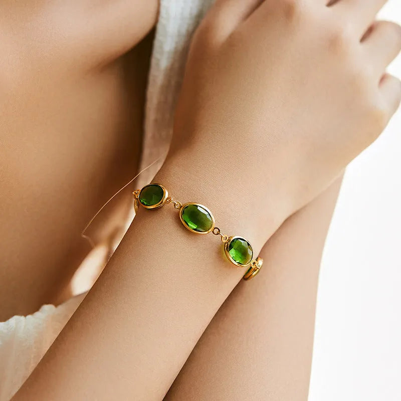 Geometric copper bracelet with blue inlaid glass elliptical design for women.