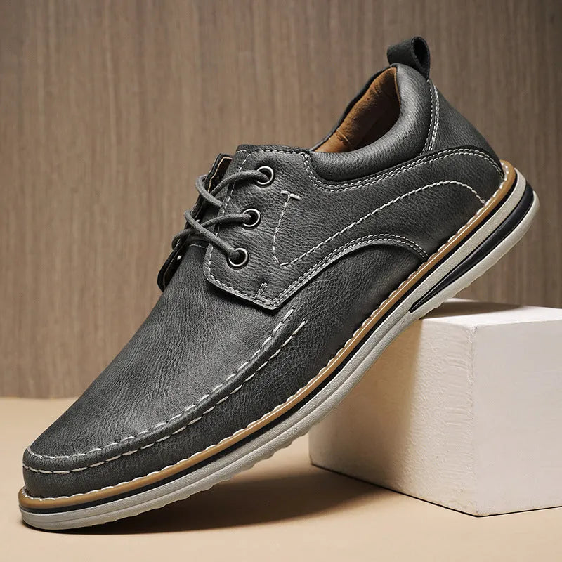 Men's brown genuine leather casual shoes with round toe and lace-up front on rubber sole