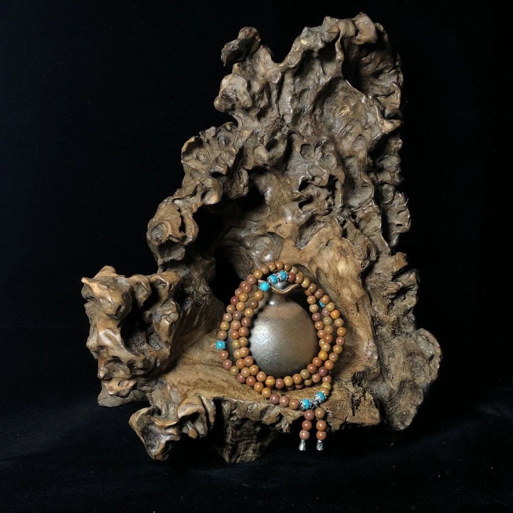 Handmade geometric stone bead bracelet with 108 polished beads in natural colour