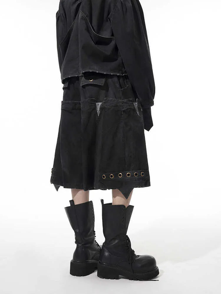 Men's black loose cropped pants with double waist design and washed stitching details
