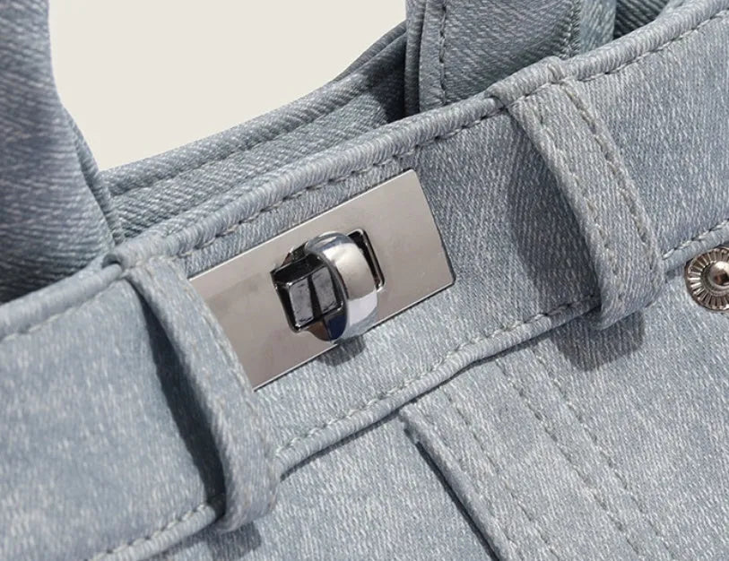 Women's casual shoulder bag in denim blue or white colour made from soft PU material