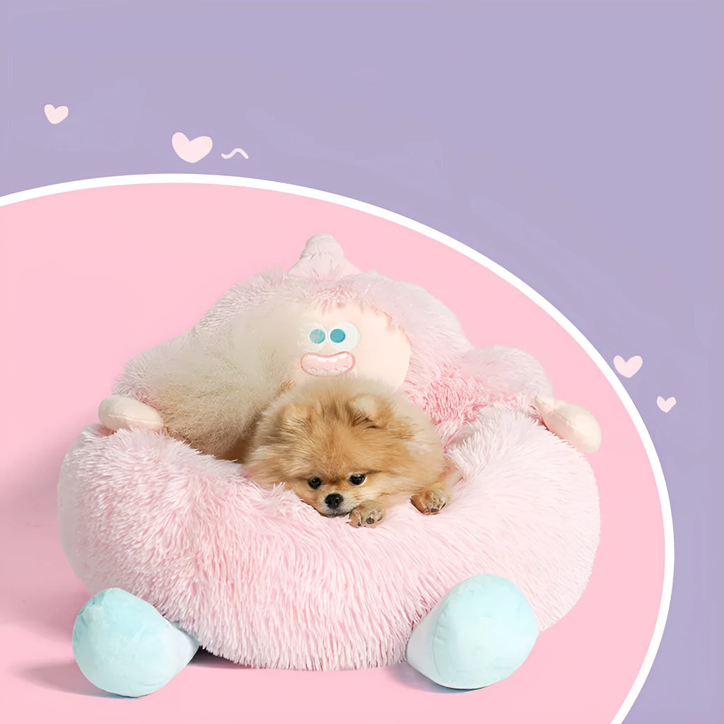Grey plush circular pet nest bed with high sides for a cat or dog to sleep in.
