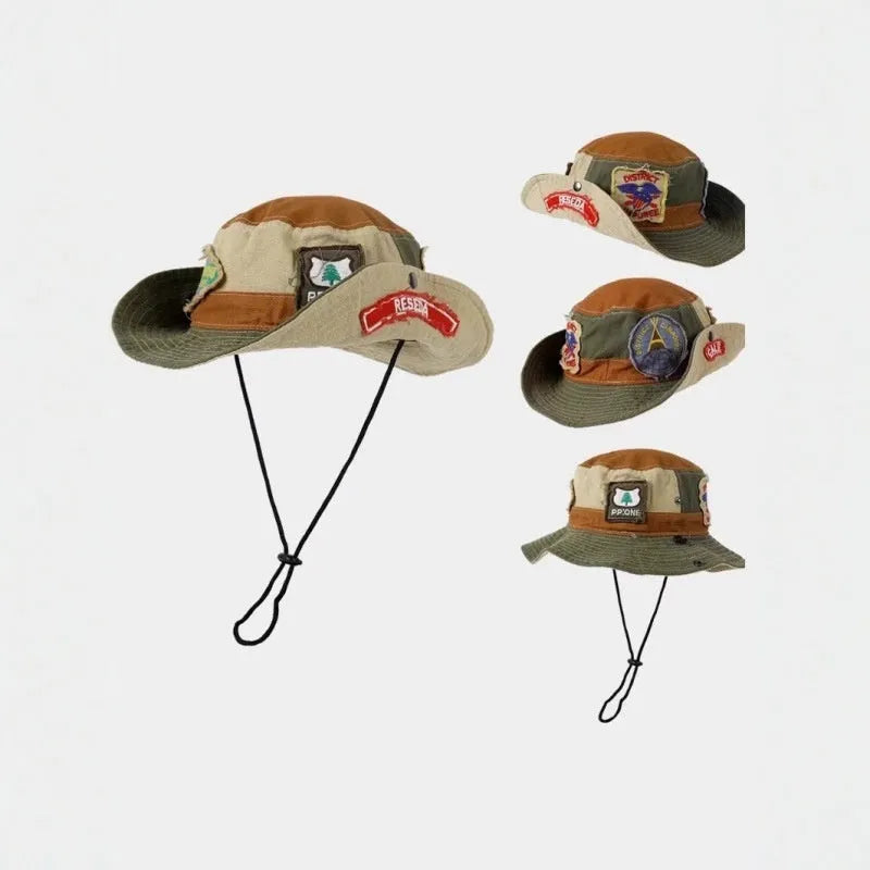 Army green cotton fisherman hat with hand-painted patchwork on flat top crown, folded for storage