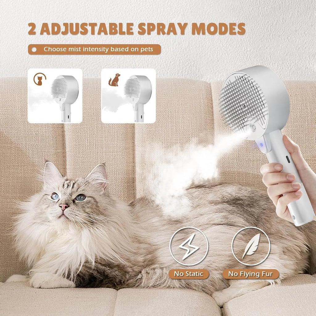 Pink and white cat steam brush with transparent water tank and stainless steel bristles for pet grooming