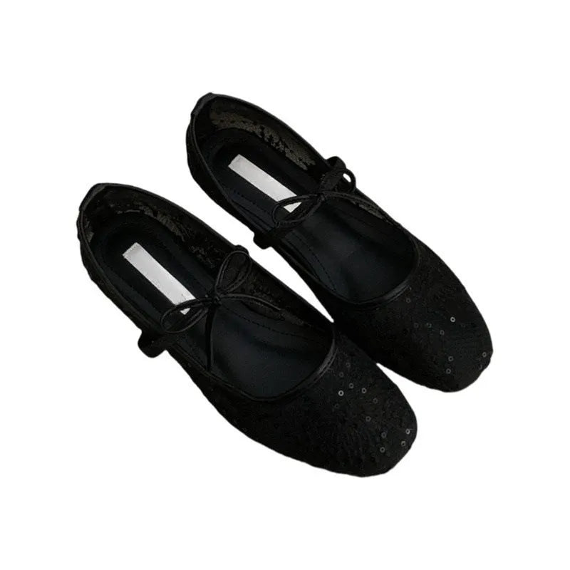 Women's flat lace mesh Mary Jane shoes in pink with a mid heel and buckle strap.