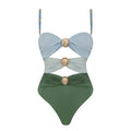 Women's green one-piece swimsuit with round buckle decoration and hollow-out stitching detail on front.