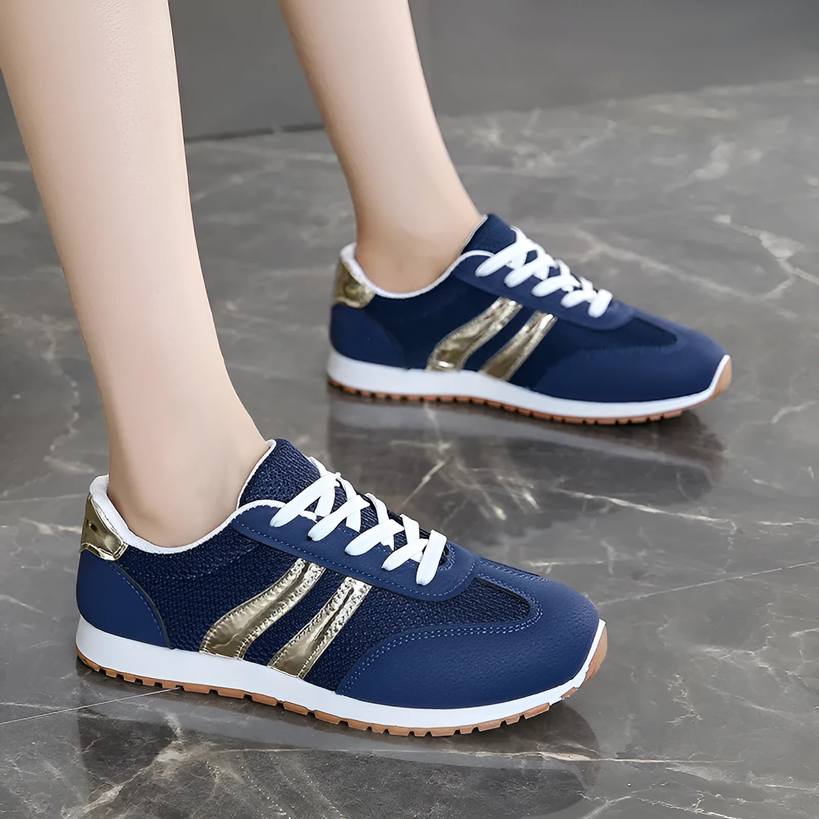 Blue women's lace-up casual sports shoes with cross straps and a flat rubber sole.