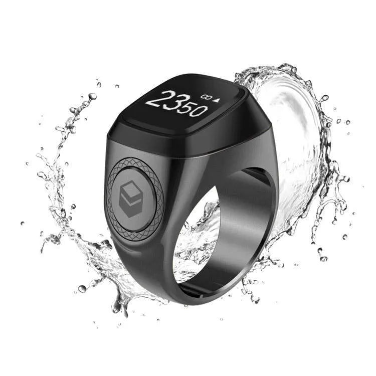 Zikr1 smart ring in silver with 0.49-inch OLED display showing time and Tasbih count on a finger