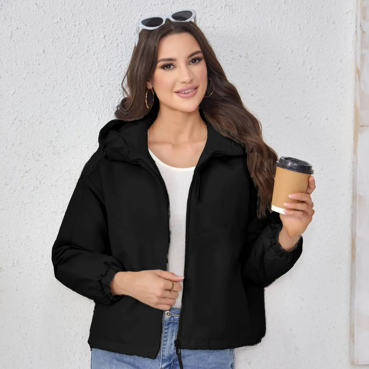 Women's loose-fit hooded shell jacket in grey shown from the front, with long sleeves and a zip front.