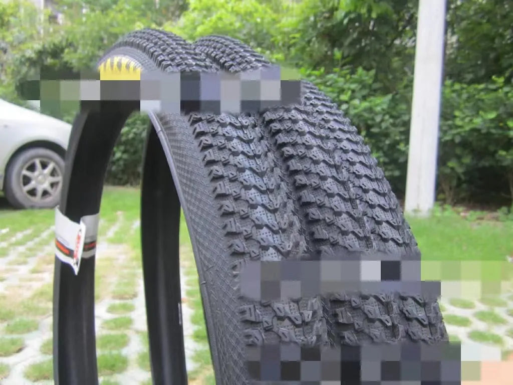Mountain bike tyre showing tread pattern and sidewall with size markings