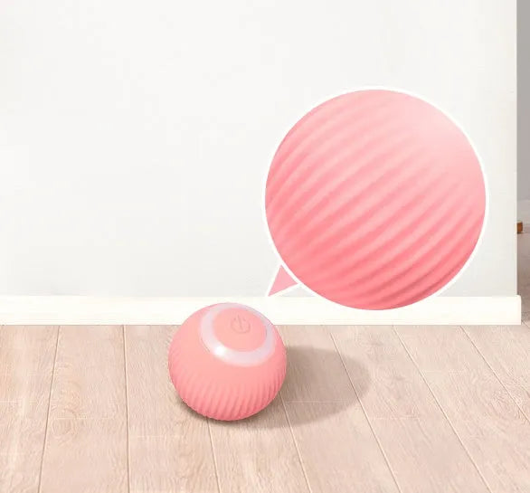 Green automatic rolling ball cat toy with a 43mm ball on a hard floor