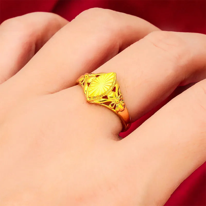 Gold geometric flower ring with textured surface and open adjustable band design