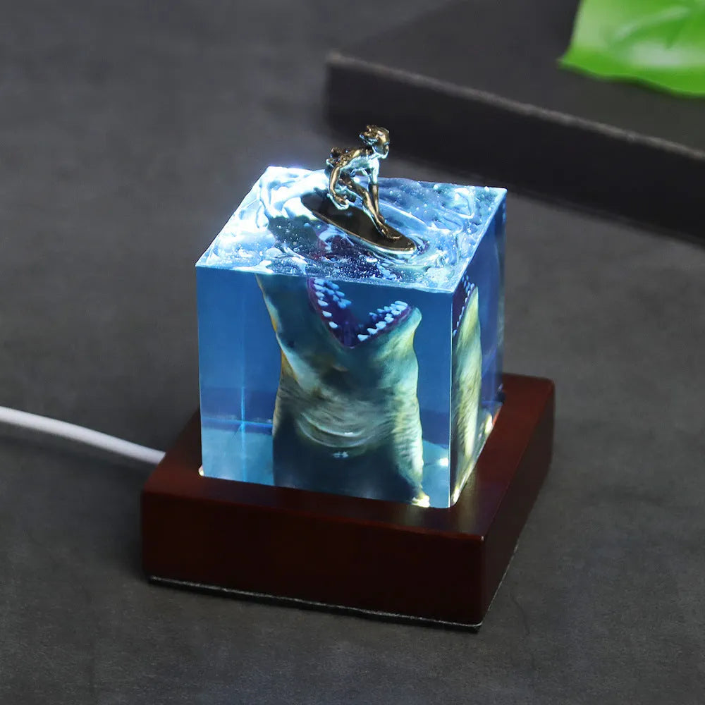 Ocean Shark Surfer resin night light ornament with integrated LED holder in 5cm or 8cm size, showing handcrafted shark surfing scene