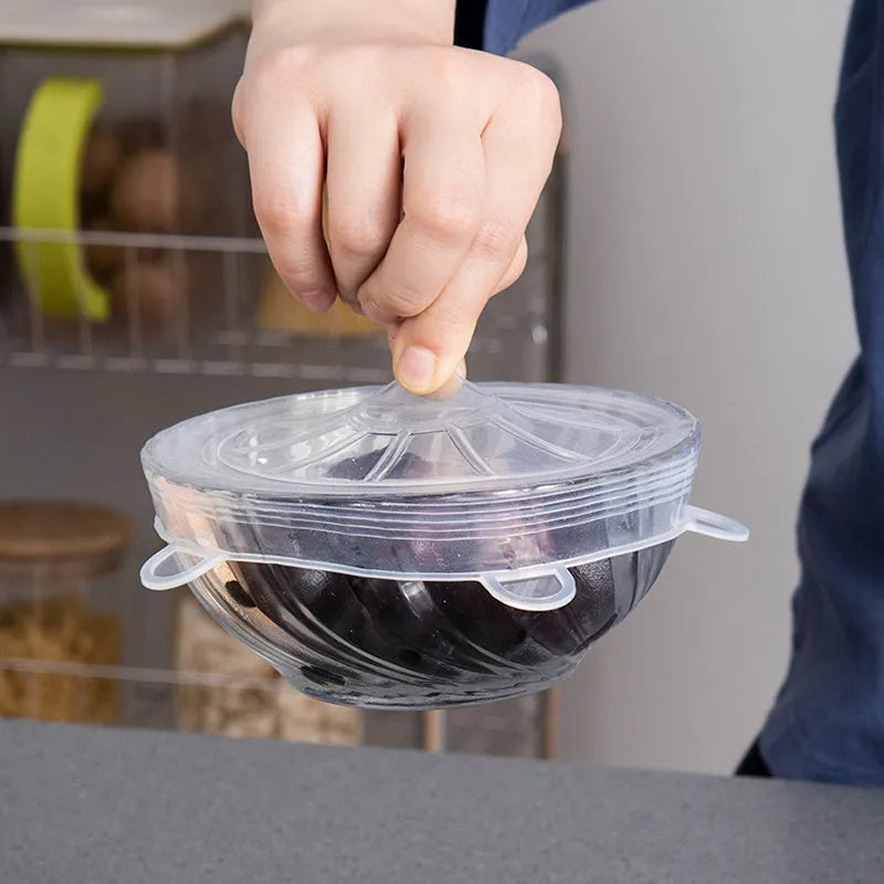 Set of six colourful silicone stretch lids in different sizes for covering food containers.