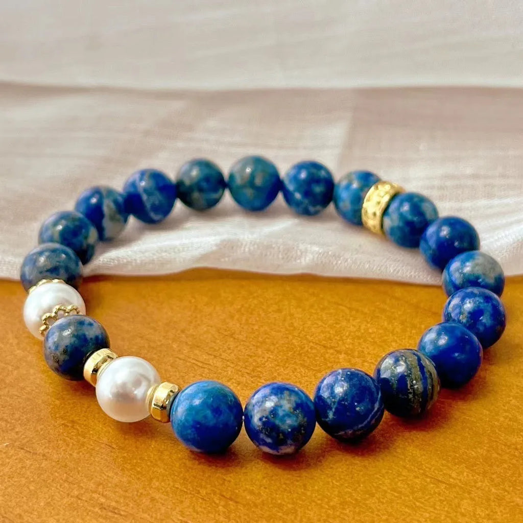 Chinese style artistic retro bracelet made with genuine blue and gold lapis lazuli beads.