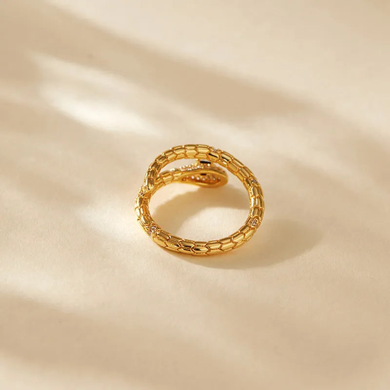 Gold coloured snake ring with open mouth design and adjustable opening