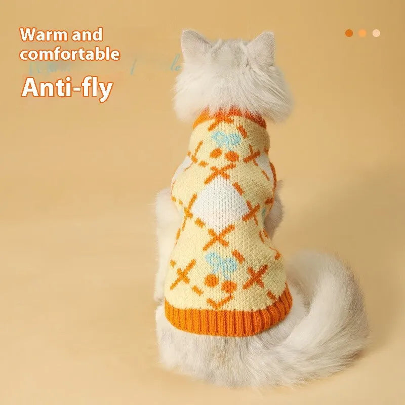 Orange knitted cat sweater with a cherry pattern, sized for small to large cats in autumn and winter.