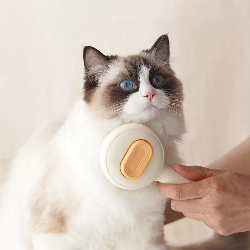 Cat grooming brush with stainless steel pins and non-slip handle in green or yellow colour