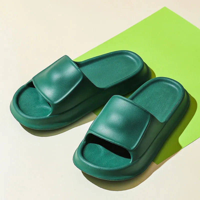 EVA flip-flop slippers with thick sole in multiple colours on a bathroom floor