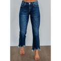 Women's hand-worn denim trousers in dark blue, showing 100% cotton fabric and casual fit