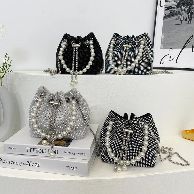 Light diamond shoulder crossbody bag with chain strap and bucket shape in soft PU.