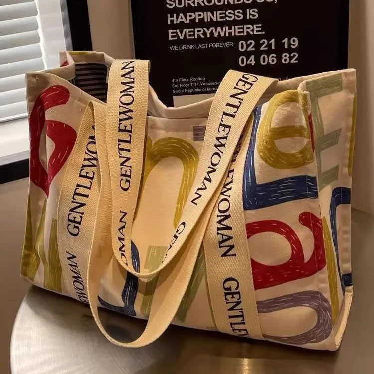 Canvas women's tote bag with printed design showing 45cm width and shoulder strap