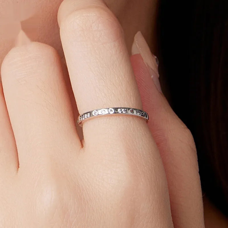 Silver Moss Password I Love You ring with oxidised black finish on a simple bracelet band.