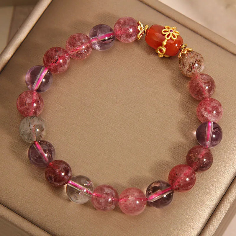 Super Seven crystal bracelet with white crystal and red agate accents on adjustable chain