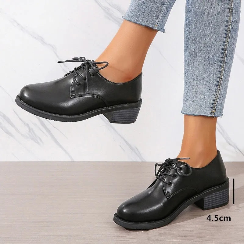 Black women's shoes with chunky 3-5cm heel, low-top design, and rubber sole for hiking