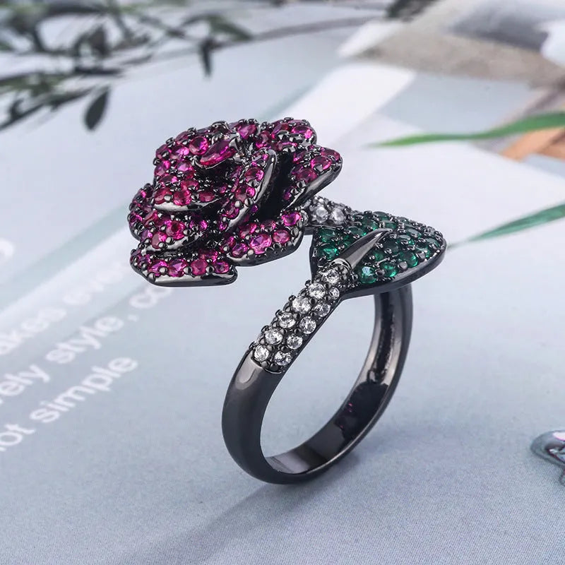 Geometric flower ring with black gold plating and red corundum stone
