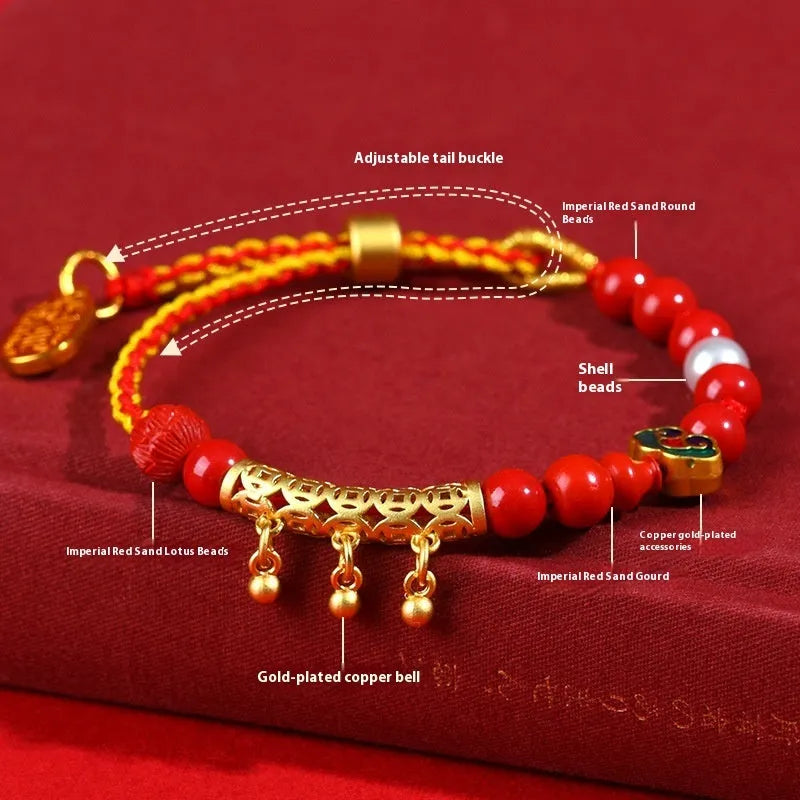 Red rope woven bracelet with round cinnabar charm and small bell for women