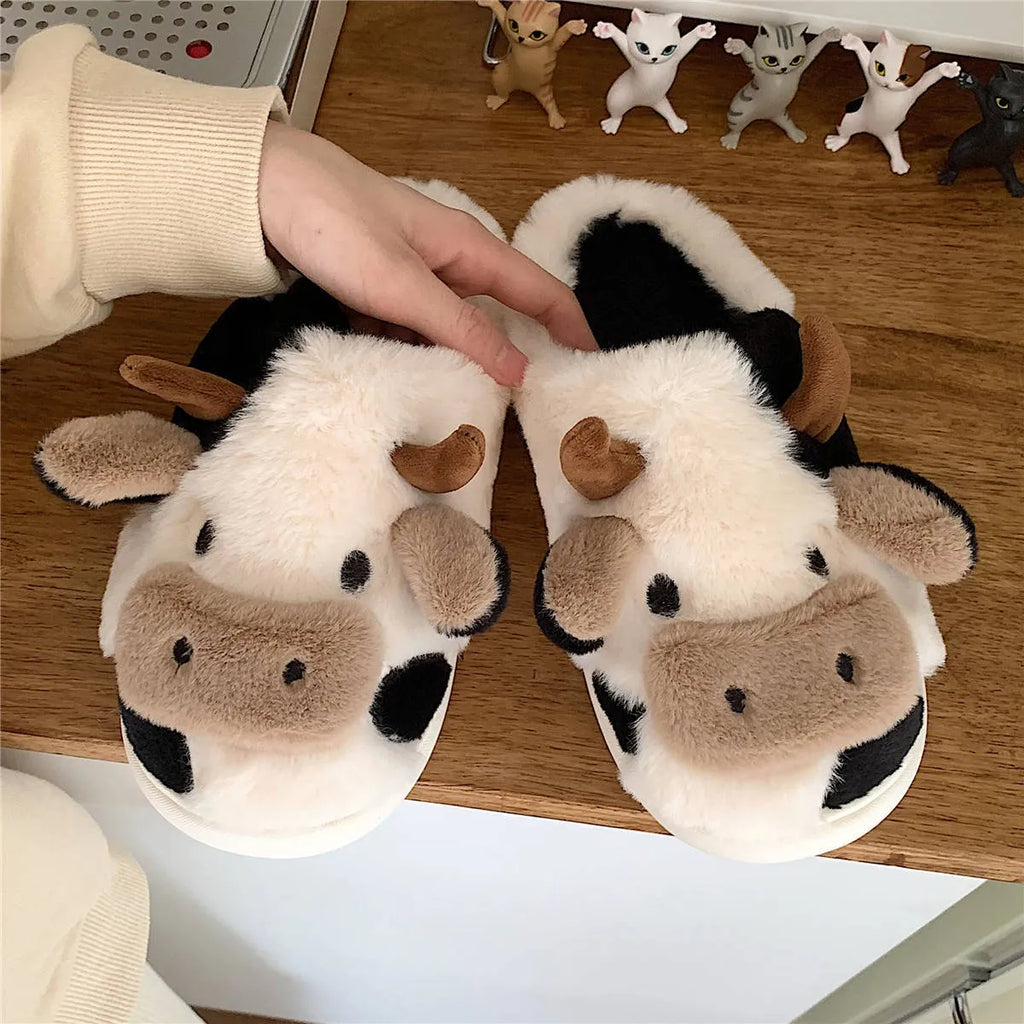 Women's cow slippers with faux fur upper, non-slip PVC sole, and plush lining in white colour