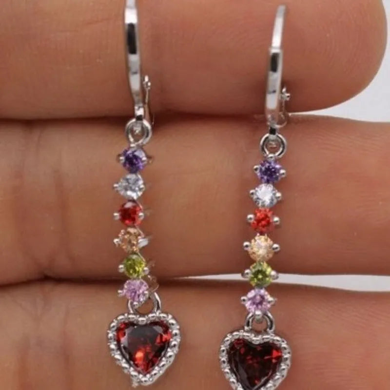 Gold and silver heart-shaped earrings with electroplated finish, showing front and back views